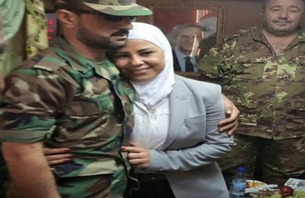 "الأسد" يقيل وزيرة بسبب "حضنت" عقيد بالجيش السوري 