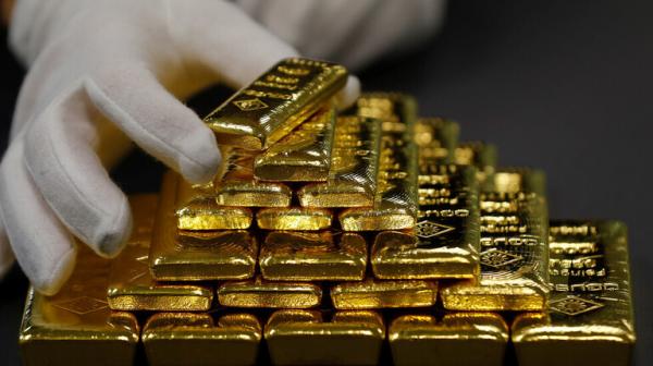 هبوط الذهب مع صعود الدولار والمستثمرون يترقبون قرارات البنوك المركزية