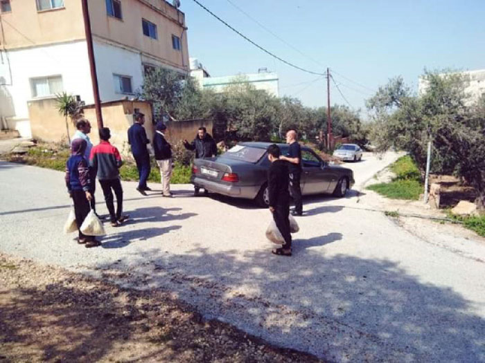 بلدة كفركيفيا في اربد ..  7 شبان يتطوعون لتأمين حاجات البلدة لمنع الاختلاط بين سكانها