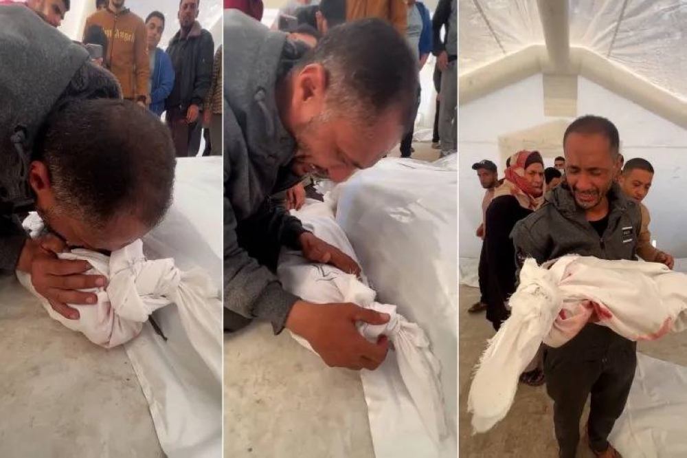 بالفيديو ..  جدٌ مكلومٌ يناجي جثمان حفيدته الشهيدة بغزة ..  يا روح القلب 