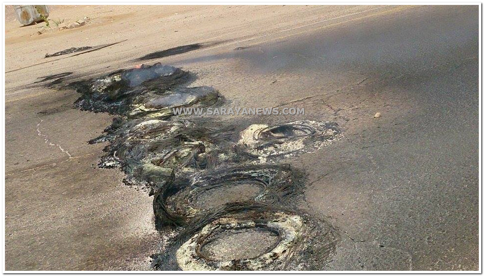بالصور  ..  شغب وحرق إطارات وإغلاق طريق وادي عربة الرئيسي في العقبة