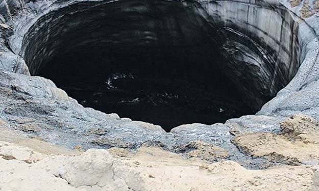 بالصور : ظهور حفرتين جديدتين بجوار حفرة "نهاية العالم"