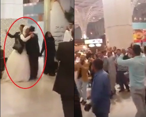 بالفيديو ..  القبض على عروسين بعد ان حمل العريس زوجته استعداداً لترحيلهما في مطار المدينة المنورة