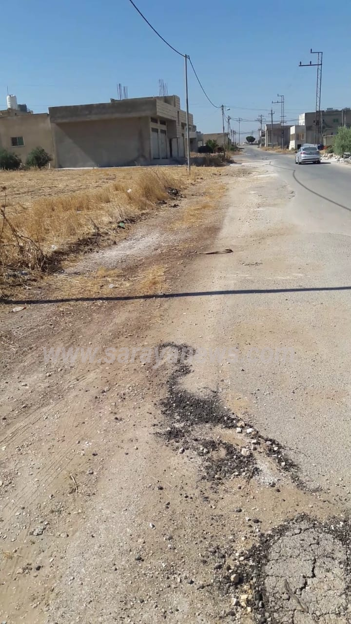 بالفيديو و الصور  ..  اربد : مدخل بلدة بشرى  يفتقر لعمليات التأهيل والصيانة ..  والبلدية ترد