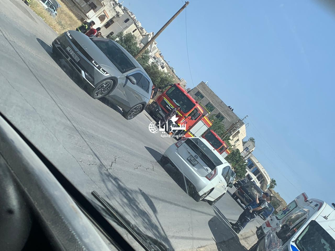 بالصور ..  حادث تصادم بين مركبتين في لواء عين الباشا