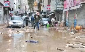 بالصور  ..  بعد قرار تعويض خساراتهم اثر فيضانات فصل الشتاء  ..  تجار وسط البلد يحتفلون 