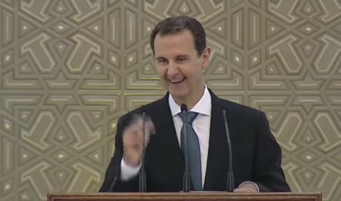 شاهدوا بالفيديو  ..  بشار الأسد يُقاطع الحاضرين لحفل تنصيبه بـ"نكتة"  ..  تفاصيل