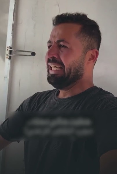 بالبكاء والدعاء ..  شاب غزي يغادر شقته في برج مشتهى قبل أن يحوّله الاحتلال إلى ركام  ..  فيديو