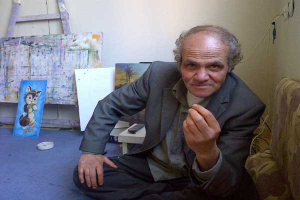 رسام بشار الأسد  يدعو الثوار لتدمير مئات اللوحات التي رسمها لآل الأسد